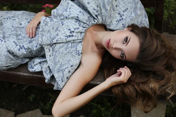 Gorgeous sexy woman with dark hair in elegant dress — Stock Photo, Image