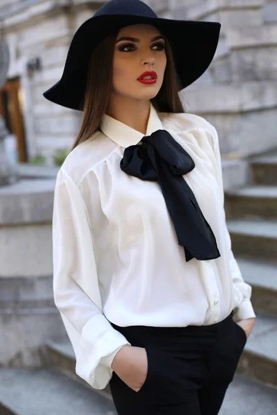 Beautiful elegant ladylike woman in blouse and felt hat — Stock Photo, Image