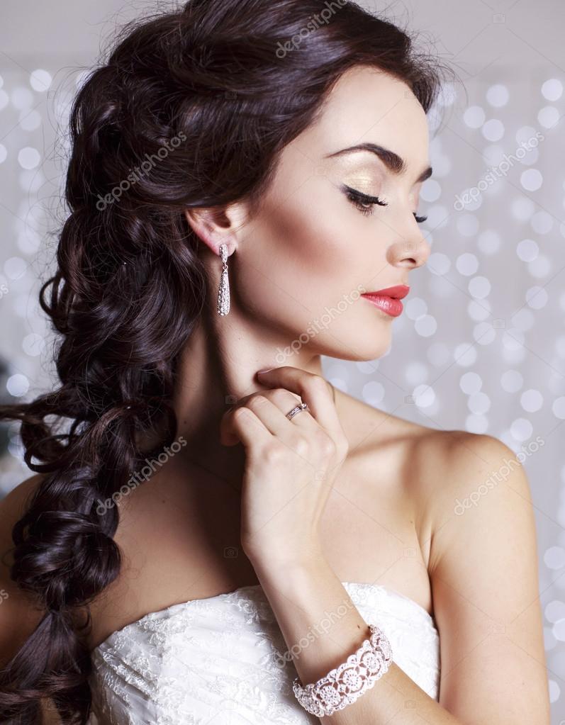 Beautiful Elegant Bride With Dark Hair Posing At Studio