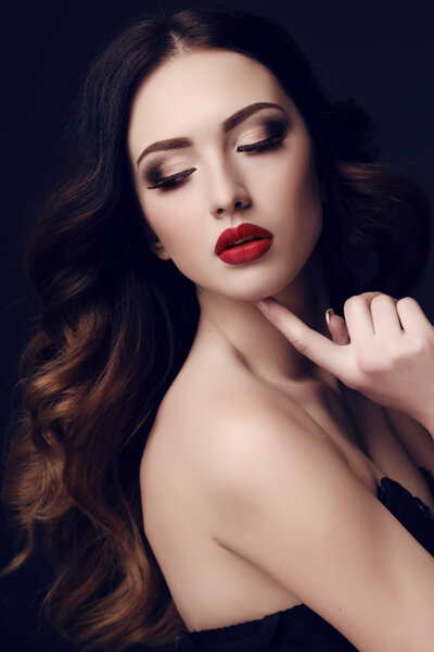 beautiful sexy woman with dark hair and bright makeup  