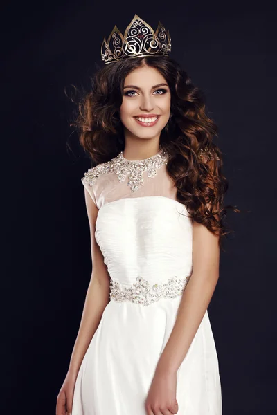 Gorgeous young woman with luxurious hair wearing crown of beauty contest — Stock Photo, Image