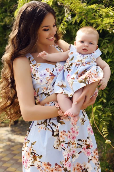 Like mother like daughter. beautiful family in similar dresses — Stock Photo, Image