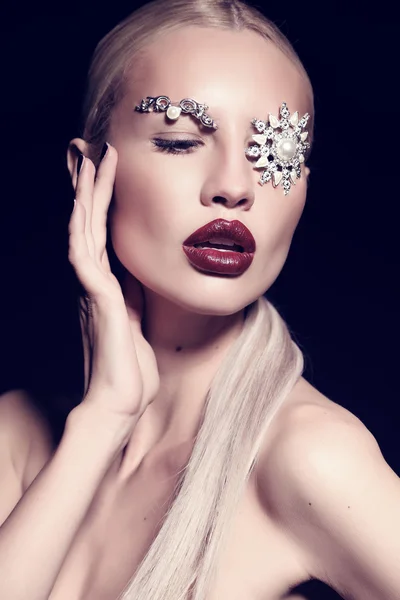 Sexy blond woman with fantastic makeup with bijou accessories — Stock Photo, Image