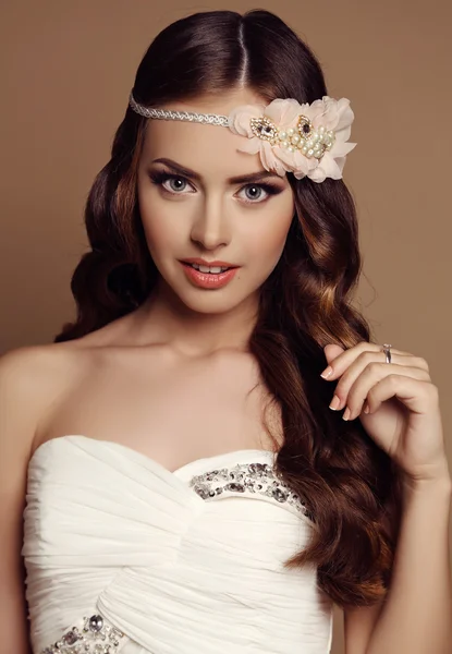 Beautiful young girl with dark hair with flower's headband — Stock Photo, Image