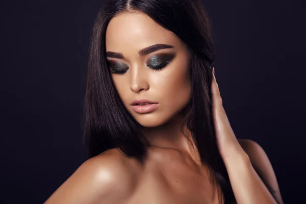 Sexy girl with dark hair and evening makeup — Stok fotoğraf