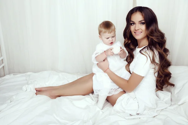 Beautiful family photo. gorgeous mother with her little cute baby girl — Stock Photo, Image