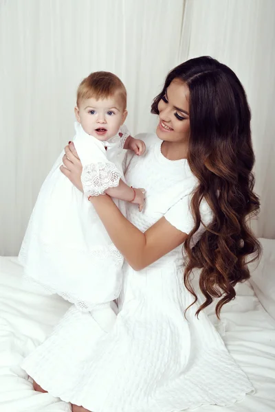 Beautiful family photo. gorgeous mother with her little cute baby girl — Stock Photo, Image