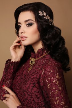 sexy girl with dark hair wears elegant lace dress, luxurious necklace and tiara  