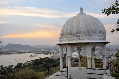 Pavillon with Udaipur city palace at Pichola lake, Udaipur, Rajasthan, India clipart