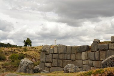 Inca fortress Saksaywaman with Jesus statue, Cusco, Peru clipart
