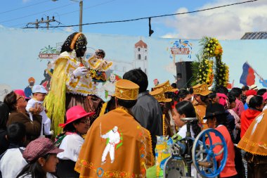 Mama Negra on a horse at traditional Latacunga festival clipart