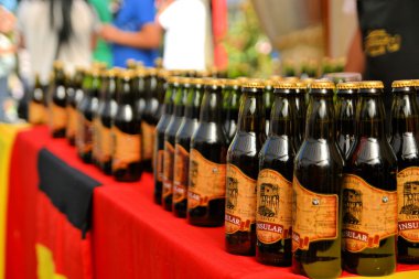 Bottles of beer at Beerfest by former German settlers in Chilean Patagonia clipart