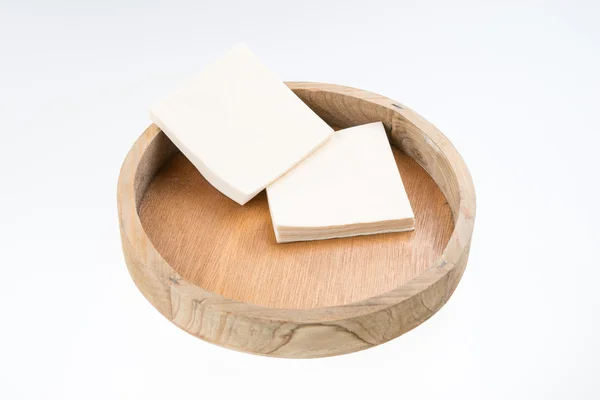 Napkins on round wooden tray — Stock Photo, Image