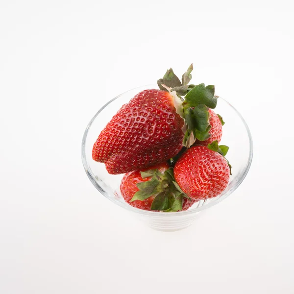 Fresh strawberries in a glass bowl — Stock Photo, Image