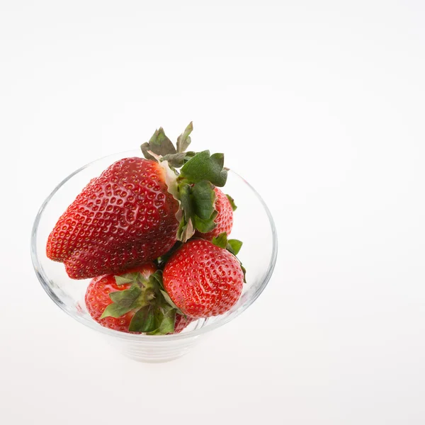 Fresh strawberries in a glass bowl — Stock Photo, Image