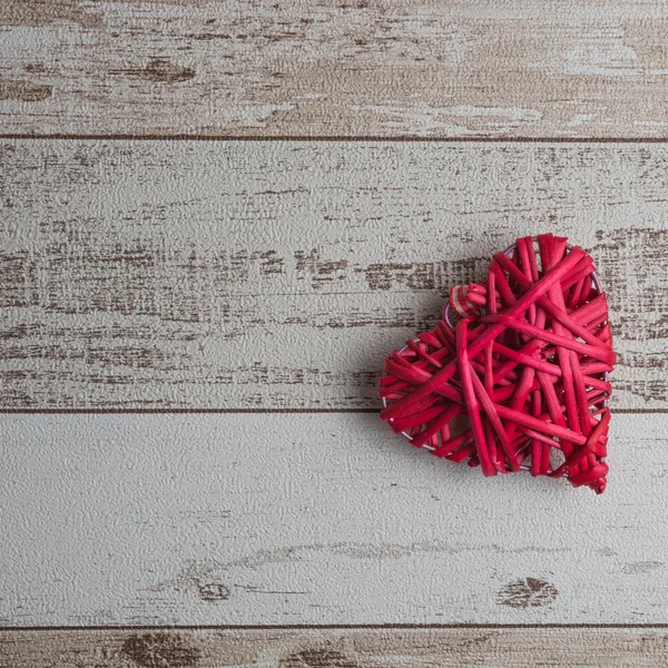 Red wood heart on wooden background — Stock Photo, Image