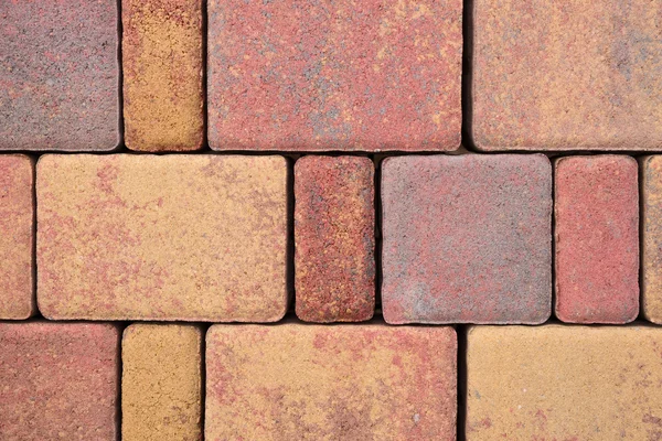Blocos de pavimentação feitos de pedras coloridas — Fotografia de Stock