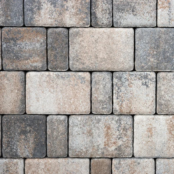 Blocos de pavimentação feitos de pedras cinzentas retangulares — Fotografia de Stock