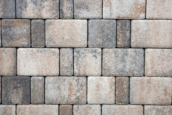 Blocos de pavimentação feitos de pedras cinzentas retangulares — Fotografia de Stock