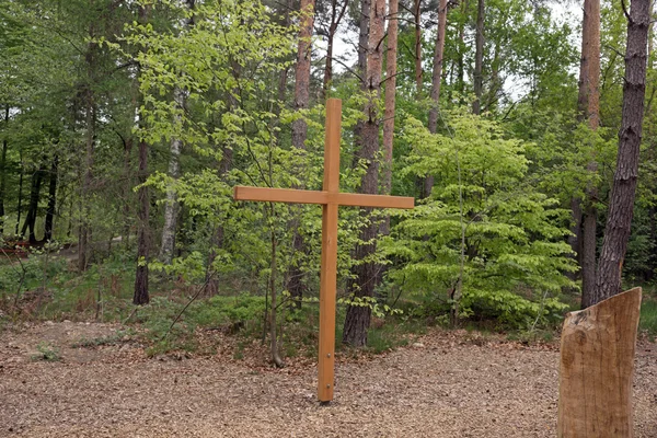 Wooden cross in the forest