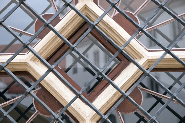 Round window with metal bars in the house