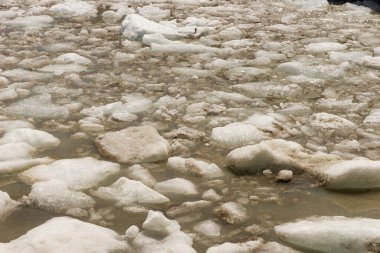 Ice floes on the water from the glacier. Ice drift, natural winter background