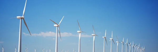 Wind Turbines Row Blue Sky Panorama — Stock Photo, Image