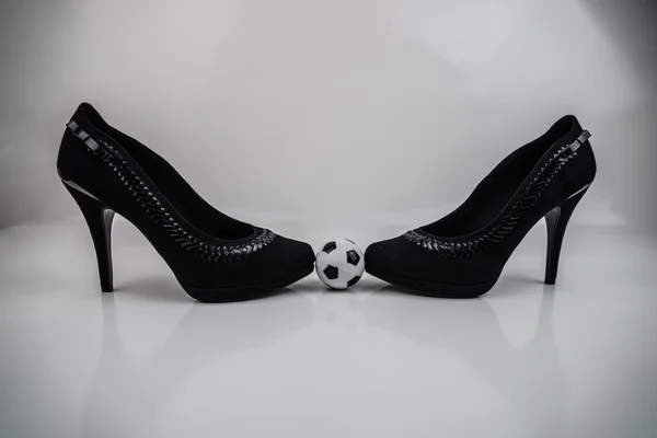 Soccer ball and high heels