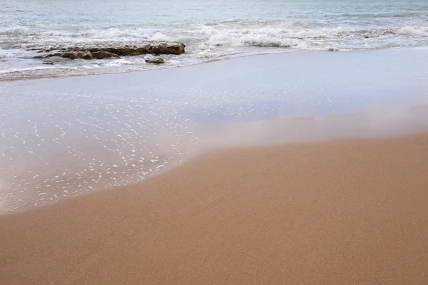 Ocean water and beach sand — Stock Photo, Image