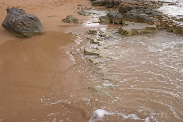 Oceaanwater en strand zand — Stockfoto