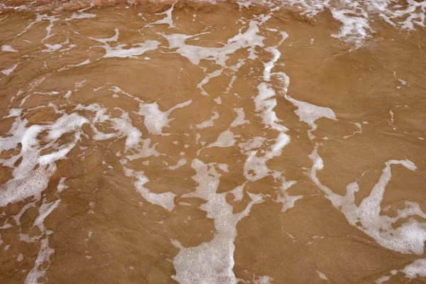 Água do oceano e areia de praia — Fotografia de Stock