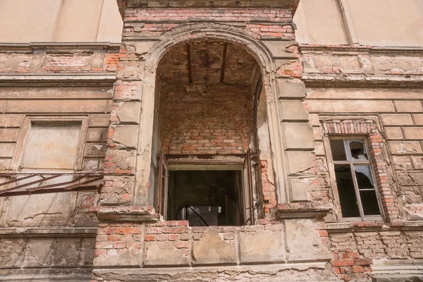 Old brick ruin wall with window