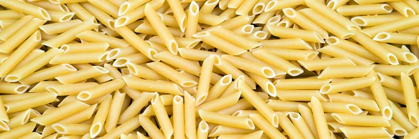 Makaron penne tekstura tło — Zdjęcie stockowe