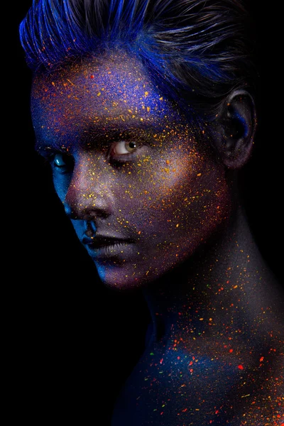 Glowing neon makeup with dramatic look in his eyes. — Stock Photo, Image