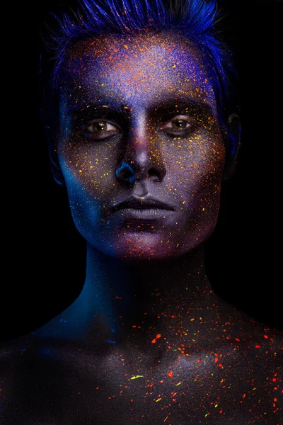 Glowing neon makeup with dramatic look in his eyes. — Stock Photo, Image