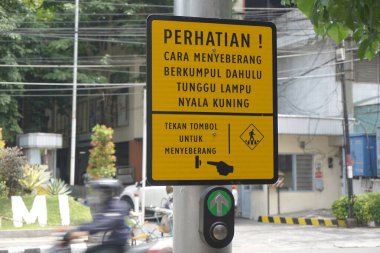 Kediri, East Java Indonesia - February 21th 2021: The signs to cross the road
