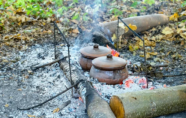 Roast in a clay pot over charcoal — Stock Photo, Image