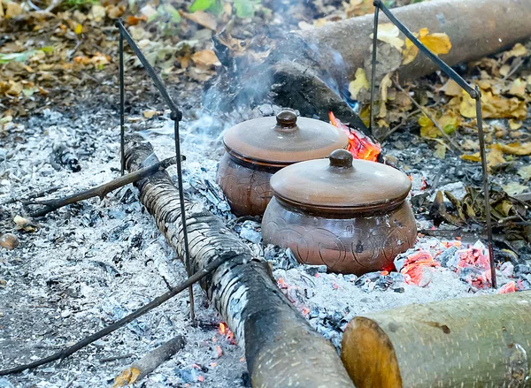 Roast in a clay pot over charcoal — Stock Photo, Image