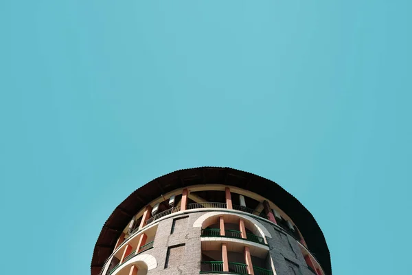 The roof of a circular building against a clear blue sky. Part of the architecture of Russia