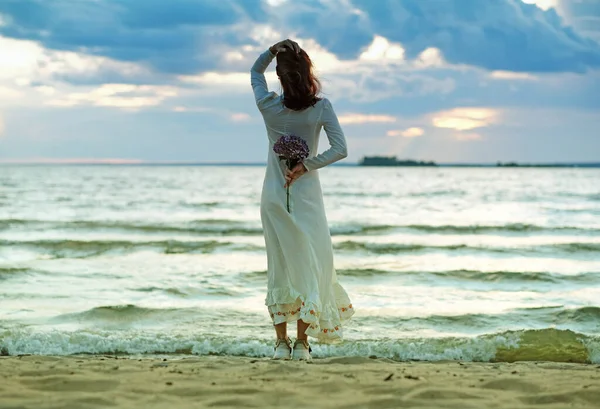 Girl White Wedding Dress Flower Her Hand Stands Her Back — Stock Photo, Image