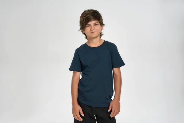 Little sportive boy child in sportswear smiling at camera, posing while standing isolated over white background — Stock Photo, Image