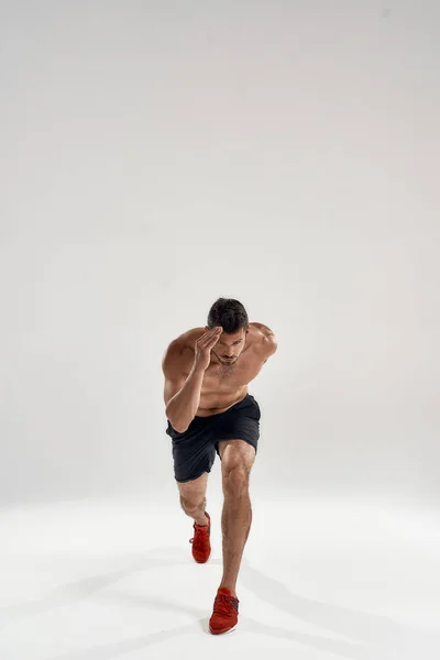 Young caucasian sportsman running at camera — Stock Photo, Image