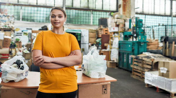 Young girl near table on garbage station