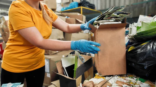 Tetra pack waste paper packed for reuse held by woman — Stock Photo, Image