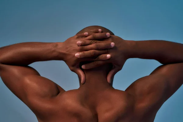 Person locking fingers behind the head back — Stock Photo, Image