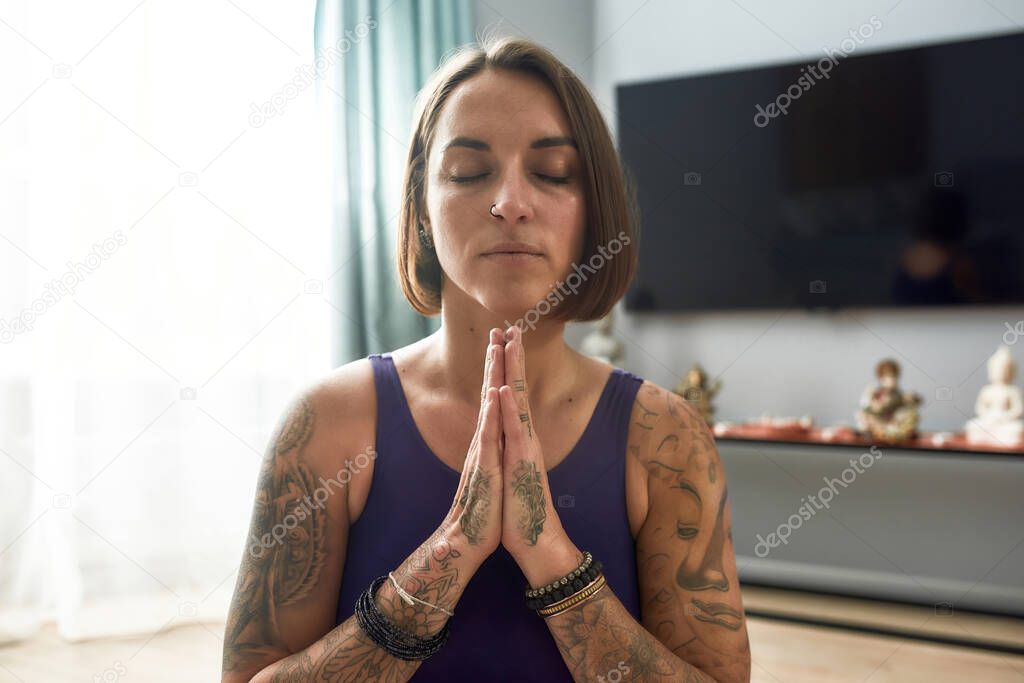 Girl closing her eyes and pray to God