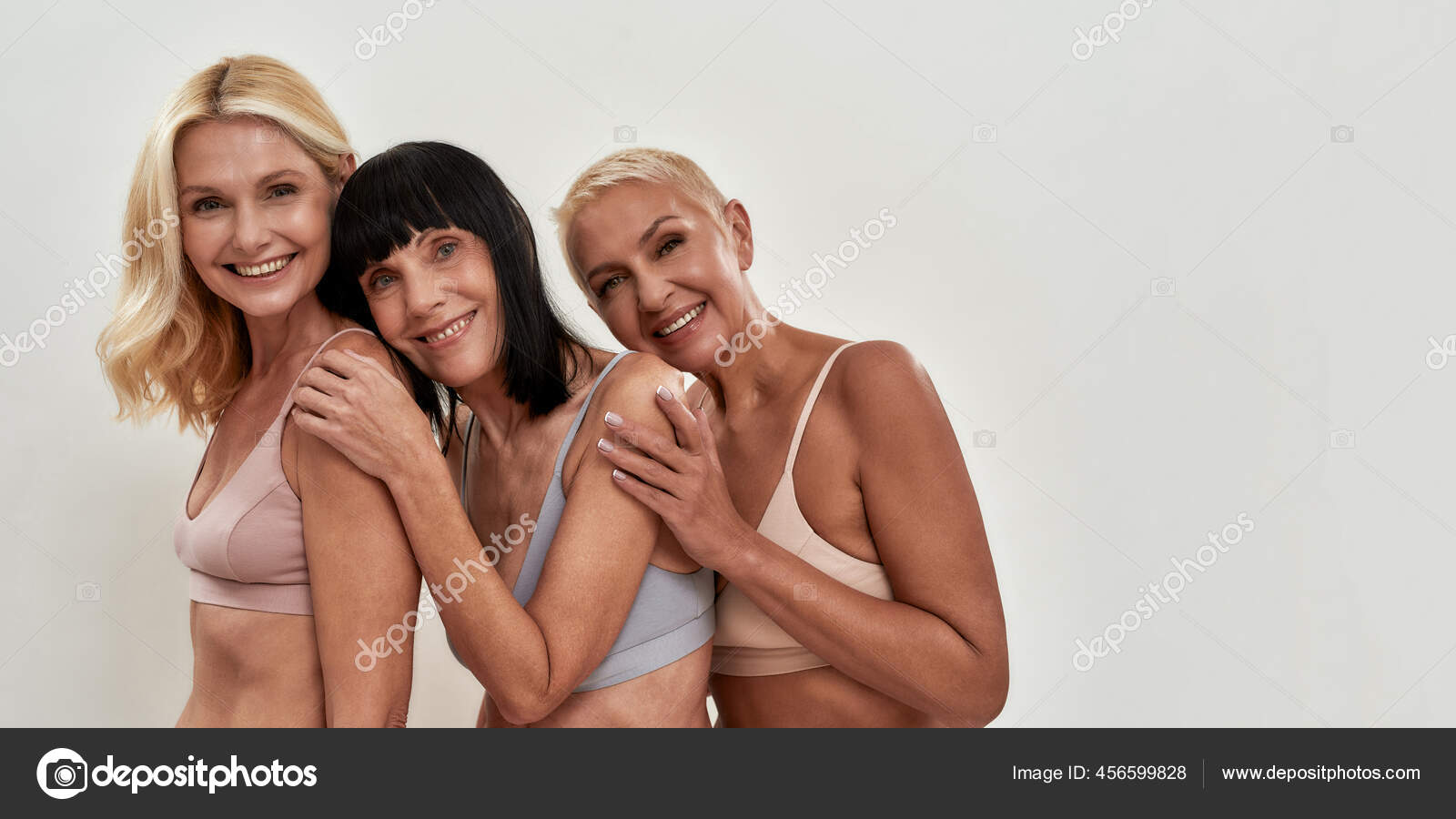 Three Attractive Middle Aged Women in Underwear Embracing Each Other while  Posing Together on Light Background Stock Photo - Image of female, adult:  212999964