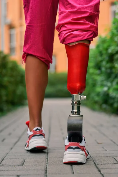 Disabled athlete person with leg prosthesis