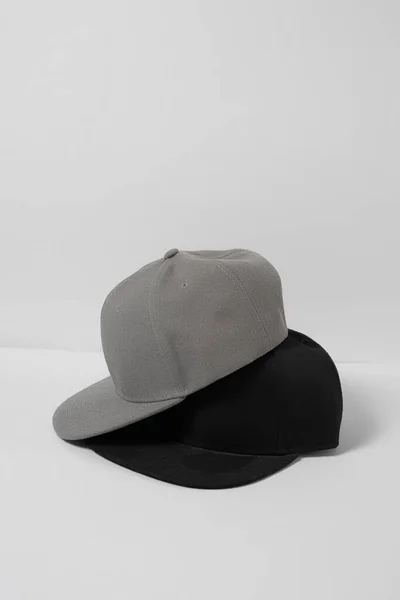 Set of blank monochrome gray and black baseball cap isolated over white background — Stock Photo, Image