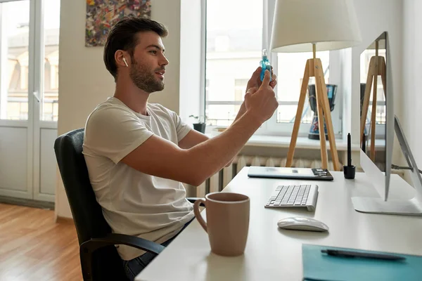 Young man is talking with somebody by video chat — Stock Photo, Image